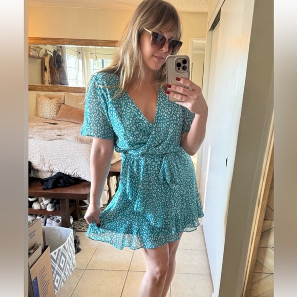 Dresses & Skirts - Flirty Aqua Cheetah Print Wrap Dress with Ruffle Detail